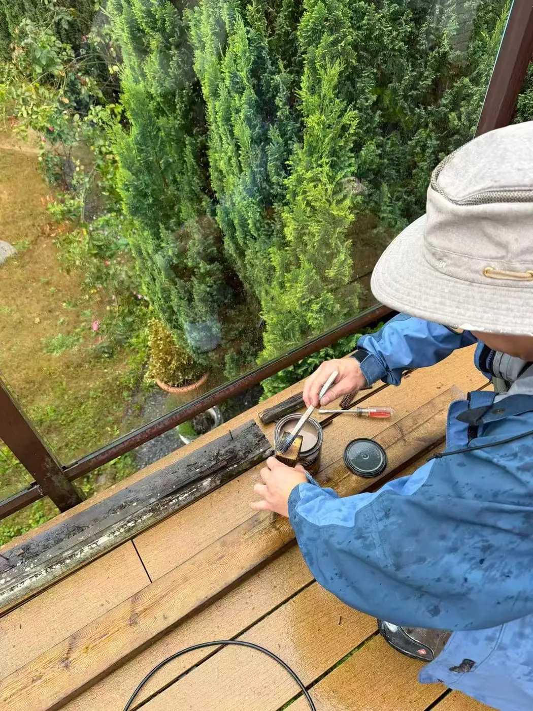 Sanding the rail before the final coat.