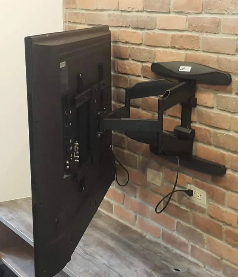 Brick wall, sleeve anchors, full-motion arm.